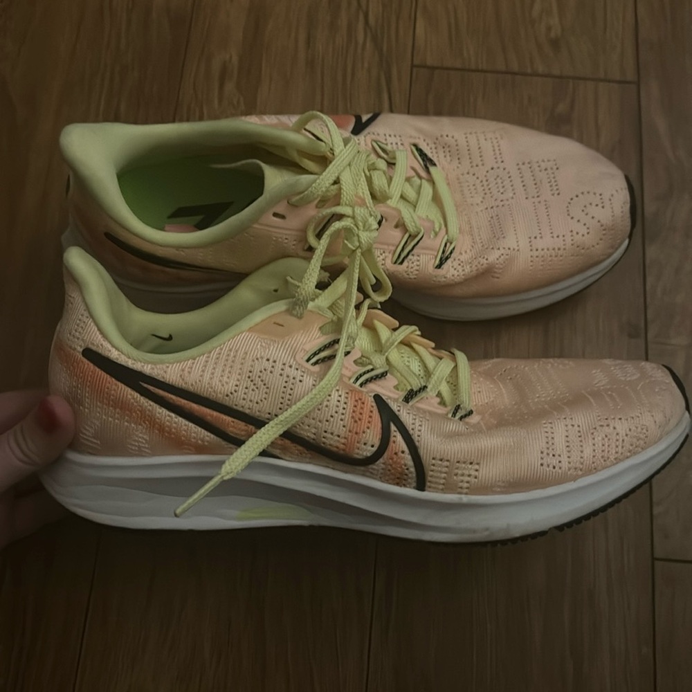 Orange and green Nike zoom max.